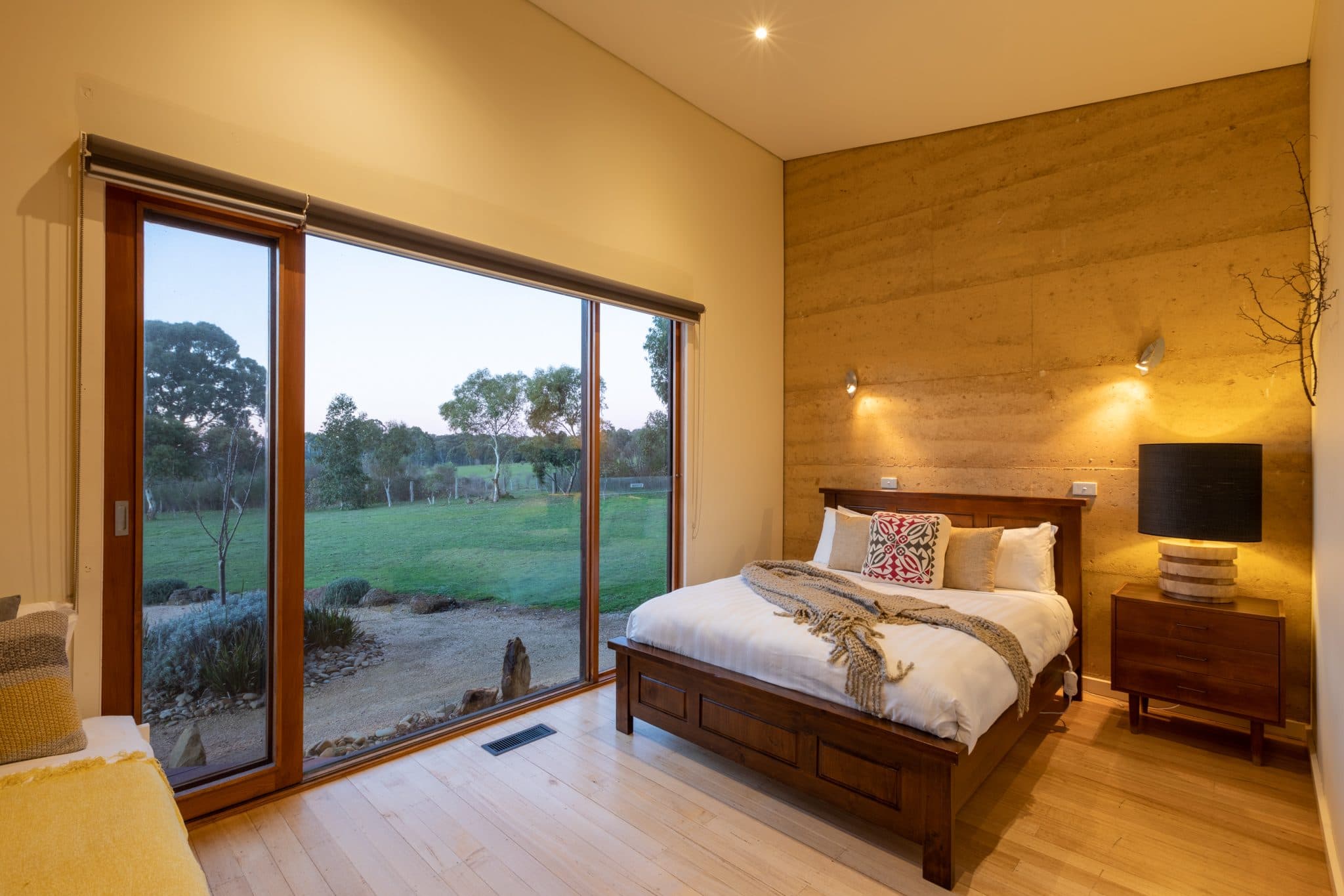Bedroom with sliding doors to the grounds