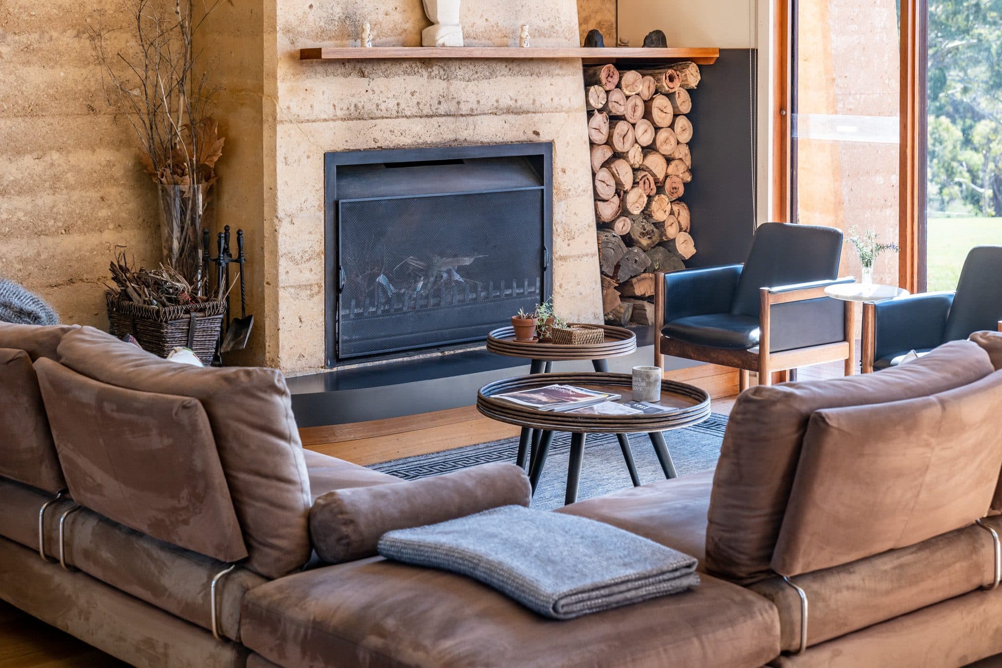 Open fireplace and armchairs